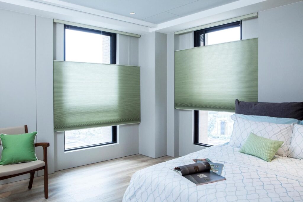 Energy-efficient honeycomb blinds, also known as pleated or cellular blinds, providing insulation and light control in a modern living space.