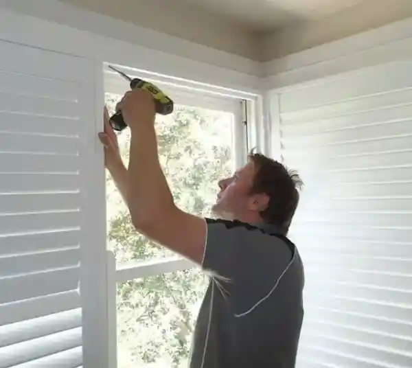 Complete Blinds Worker Installing
