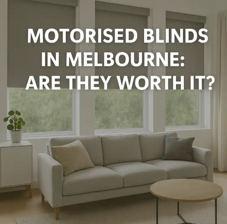 Motorised blinds in a bright Melbourne living room with modern grey furniture and large windows.