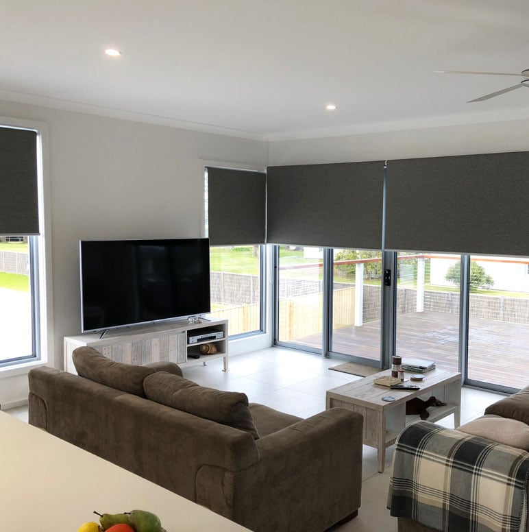 Blockout roller blinds installed in a modern Melbourne living room for light control and privacy