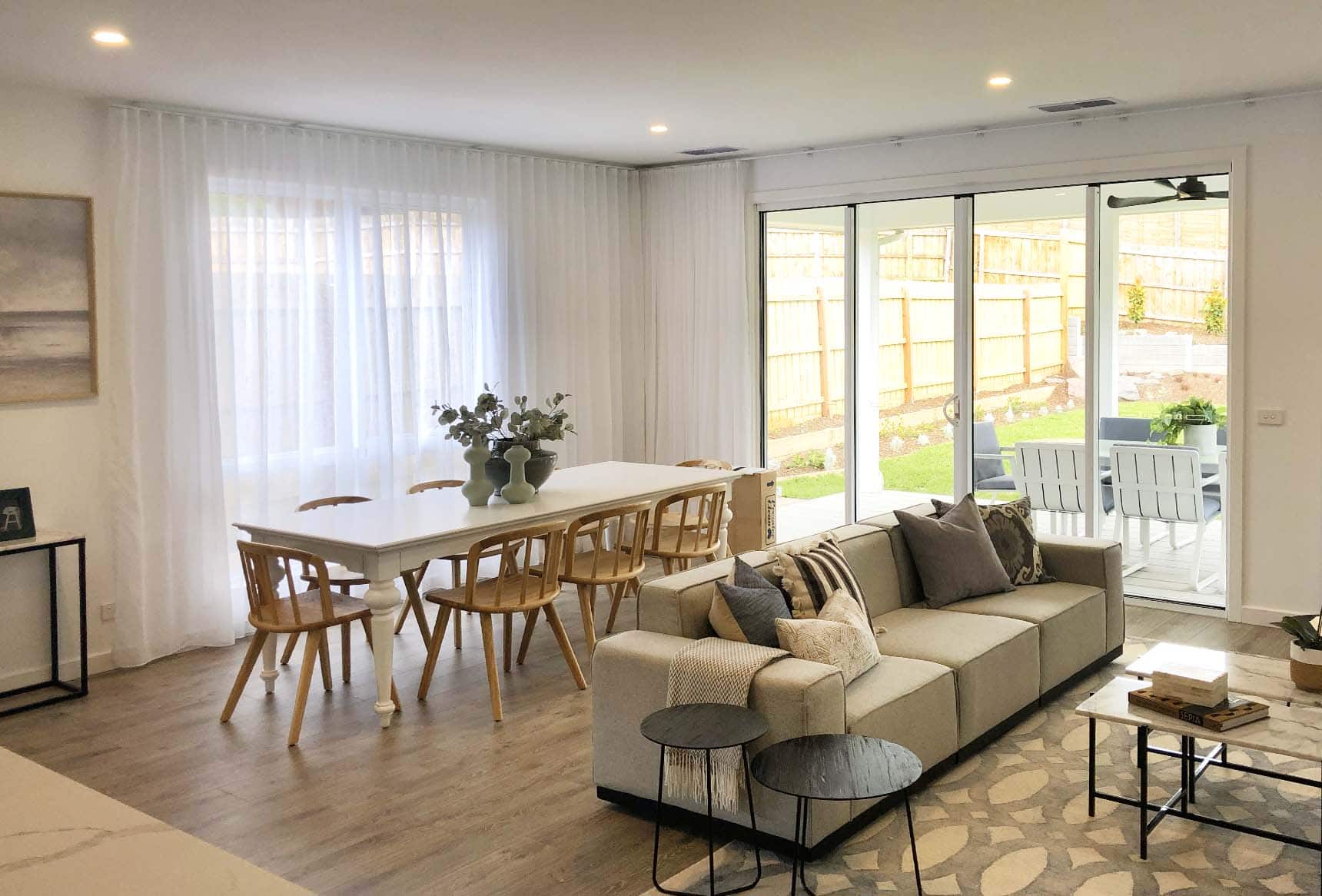 sheer curtains installed in a modern Melbourne living and dining area for daytime privacy.