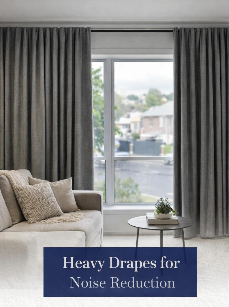 Heavy-weight drapes reducing street noise in a Melbourne living room